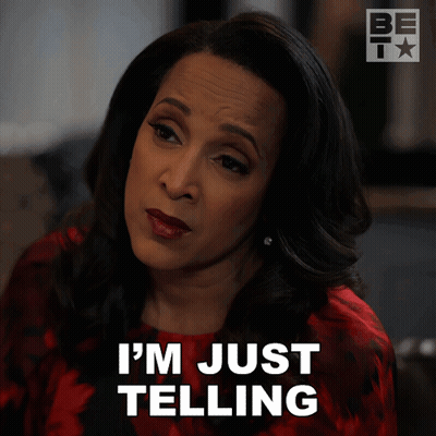 A Woman Says " I 'M Just Telling " In Front Of Her Face GIF