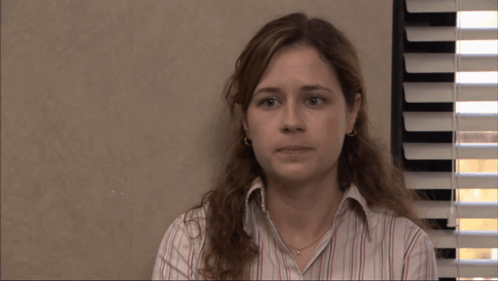 A Woman Says I 'M Kidding In Front Of Blinds GIF