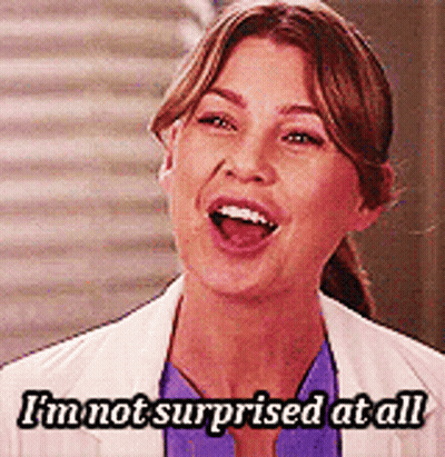 A Woman Says I 'M Not Surprised At All In Front Of A Staircase GIF