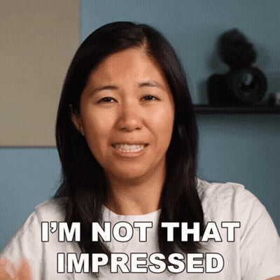 A Woman Says " I 'M Not That Impressed " While Smiling GIF