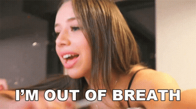 A Woman Says " I 'M Out Of Breath " In Front Of Her Face GIF