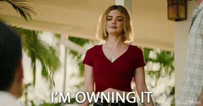 A Woman Says I 'M Owning It In A Red Shirt GIF