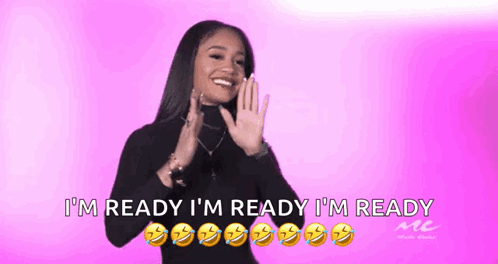 A Woman Says I 'M Ready I 'M Ready I 'M Ready In A Pink Background GIF