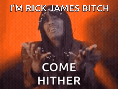 A Woman Says " I 'M Rick James Bitch Come Hither " In Front Of An Orange Background GIF
