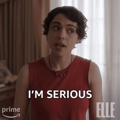 A Woman Says I 'M Serious In A Red Shirt GIF