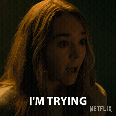 A Woman Says I 'M Trying In A Dark Room GIF