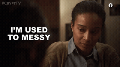 A Woman Says " I 'M Used To Messy " While Looking Down At Something GIF