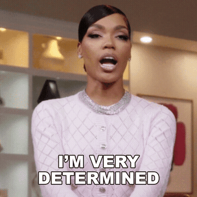 A Woman Says I 'M Very Determined In A Pink Sweater GIF
