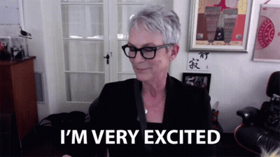 A Woman Says I 'M Very Excited In Front Of A Window GIF