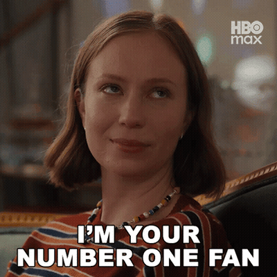 A Woman Says I 'M Your Number One Fan In A Striped Shirt GIF