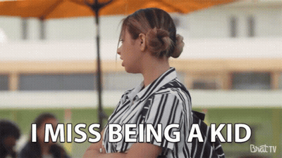 A Woman Says I Miss Being A Kid While Standing Under An Umbrella GIF