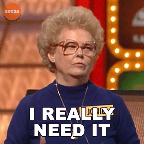 A Woman Says I Really Need It While Wearing Glasses And A Blue Shirt GIF