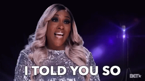 A Woman Says I Told You So In Front Of A Microphone GIF