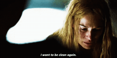 A Woman Says " I Want To Be Clean Again " In A Dark Room GIF