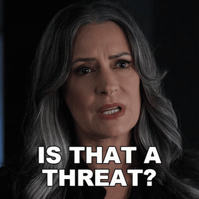 a woman says is that a threat with a serious look on her face