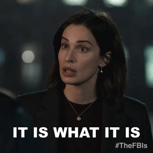A Woman Says It Is What It Is While Wearing A Necklace GIF