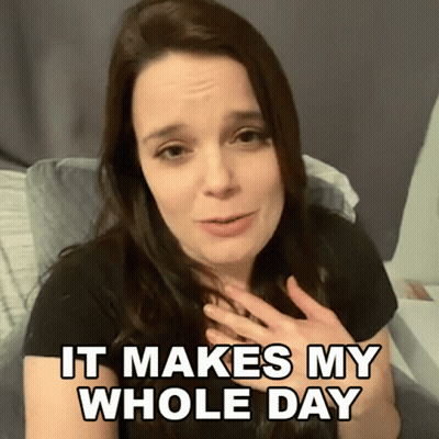 A Woman Says It Makes My Whole Day While Sitting On A Bed GIF
