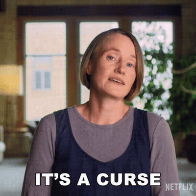 A Woman Says " It 'S A Curse " In Front Of A Netflix Logo GIF