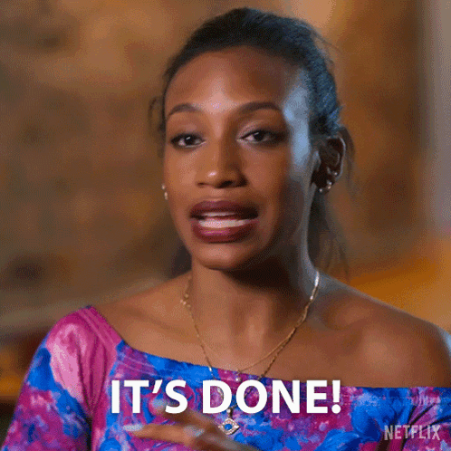 A Woman Says It 'S Done While Wearing A Pink And Blue Top GIF