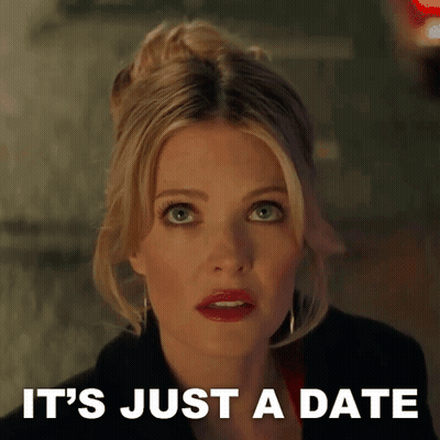 A Woman Says It 'S Just A Date While Looking At Something GIF