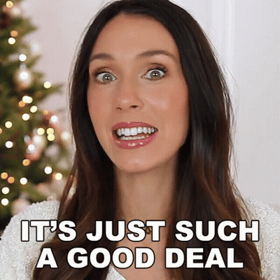 A Woman Says It 'S Just Such A Good Deal With A Christmas Tree In The Background GIF