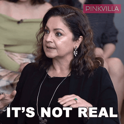 A Woman Says It 'S Not Real In Front Of A Pinkvilla Sign GIF