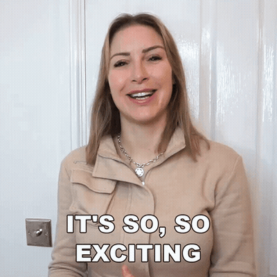 A Woman Says It 'S So So Exciting While Standing In Front Of A Door GIF