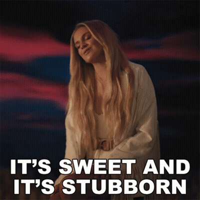 A Woman Says It 'S Sweet And It 'S Stubborn In Front Of A Cloudy Sky GIF