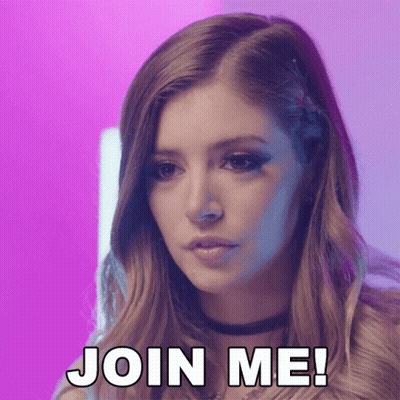 A Woman Says Join Me In Front Of A Pink Background GIF