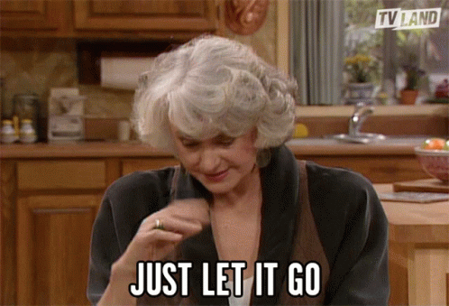 A Woman Says Just Let It Go In A Kitchen Scene GIF
