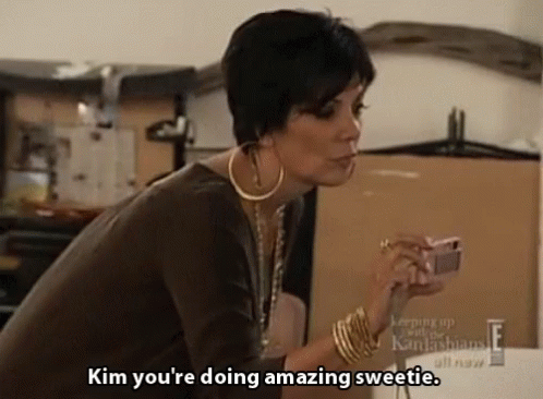 A Woman Says Kim You 'Re Doing Amazing Sweetie While Holding A Cell Phone GIF