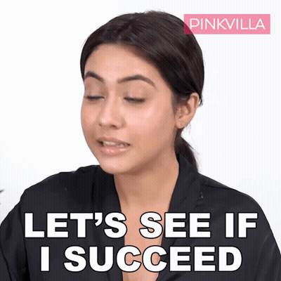 A Woman Says " Let 'S See If I Succeed " With A Pink Villa Logo Behind Her GIF
