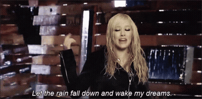 A Woman Says Let The Rain Fall Down And Wake My Dreams In A Video GIF