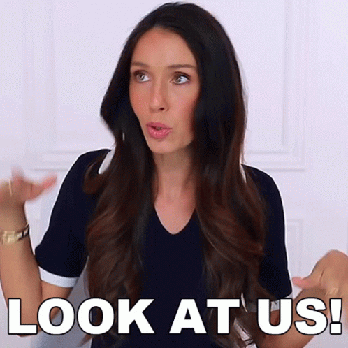 A Woman Says " Look At Us " In Front Of Her GIF