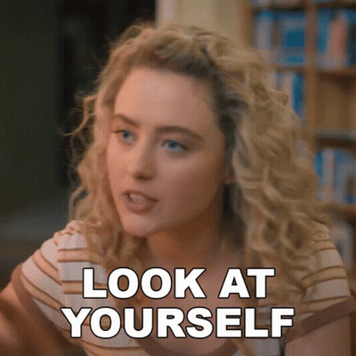 A Woman Says Look At Yourself In Front Of A Bookcase GIF