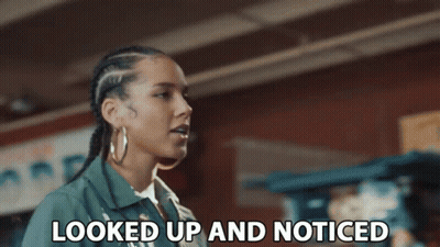 A Woman Says Looked Up And Noticed In Front Of A Brick Wall GIF