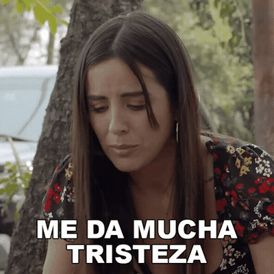 A Woman Says Me Da Mucha Tristeza While Looking Down GIF