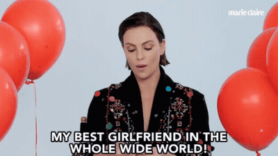 A Woman Says " My Best Girlfriend In The Whole Wide World " In Front Of Balloons GIF