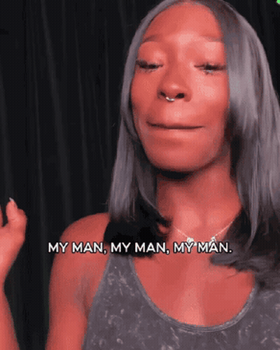 A Woman Says My Man My Man My Man In Front Of A Black Background GIF