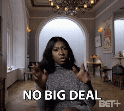A Woman Says No Big Deal In A Room With A Chandelier GIF
