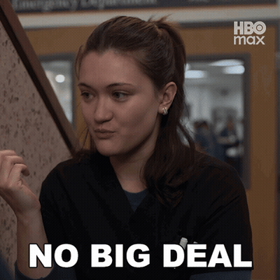 A Woman Says No Big Deal In Front Of A Hbo Max Sign GIF