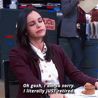 A Woman Says Oh Gosh I Am So Sorry I Literally Just Retired While Sitting At A Table GIF