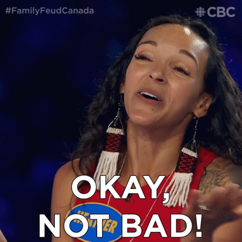 A Woman Says Okay Not Bad In Front Of A Blue Sign That Says Family Feud Canada GIF