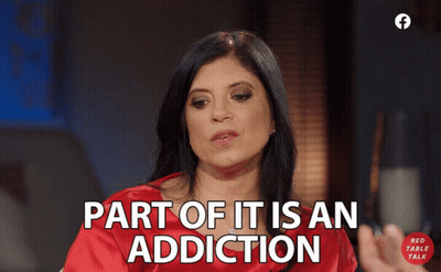 A Woman Says Part Of It Is An Addiction In A Red Shirt GIF