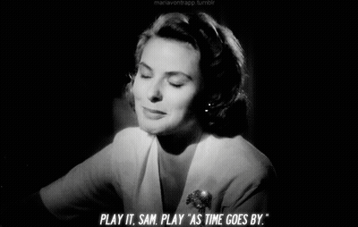 A Woman Says Play It Sam Play As Time Goes By In A Black And White Photo GIF