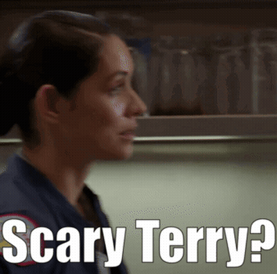 A Woman Says Scary Terry In Front Of A Shelf Full Of Glasses GIF