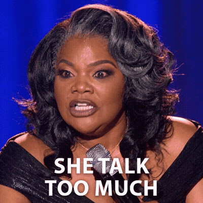 A Woman Says She Talk Too Much While Holding A Microphone GIF