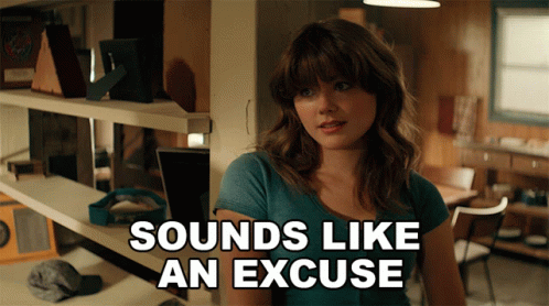 A Woman Says Sounds Like An Excuse In Front Of A Shelf GIF