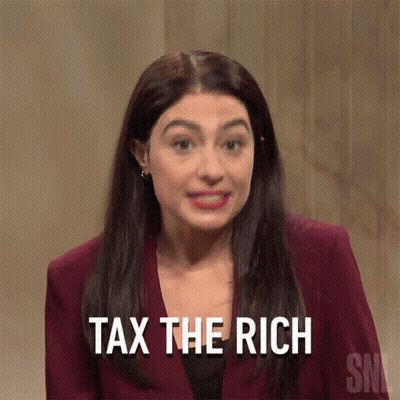 A Woman Says " Tax The Rich " While Wearing A Maroon Suit GIF