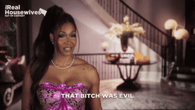 A Woman Says That Bitch Was Evil In Front Of A Real Housewives Logo GIF